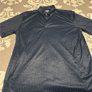 NWT. Greg Norman Polo. 
Size XL